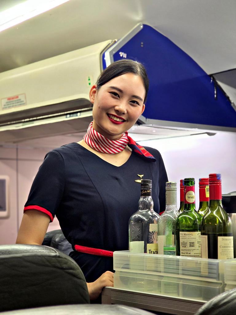 Yuna practicing beverage service during cabin crew training